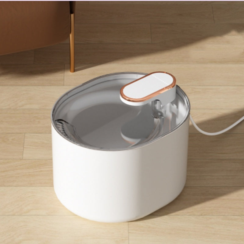 Automatic pet water fountain with a white base and clear top, showing circulating water.